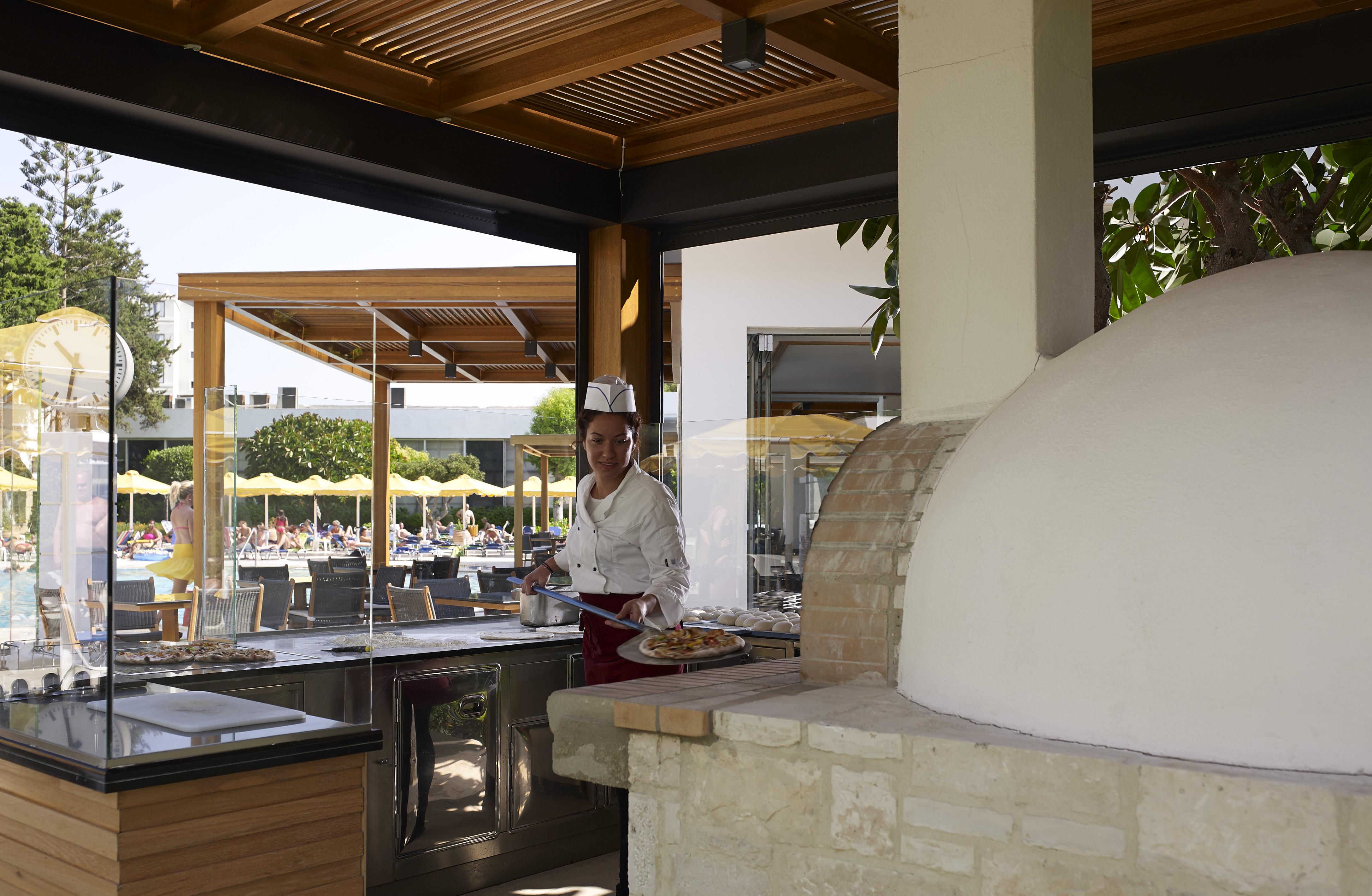 Mitsis Grand Hotel Rhodes City Exterior photo A wood-fired oven in a restaurant
