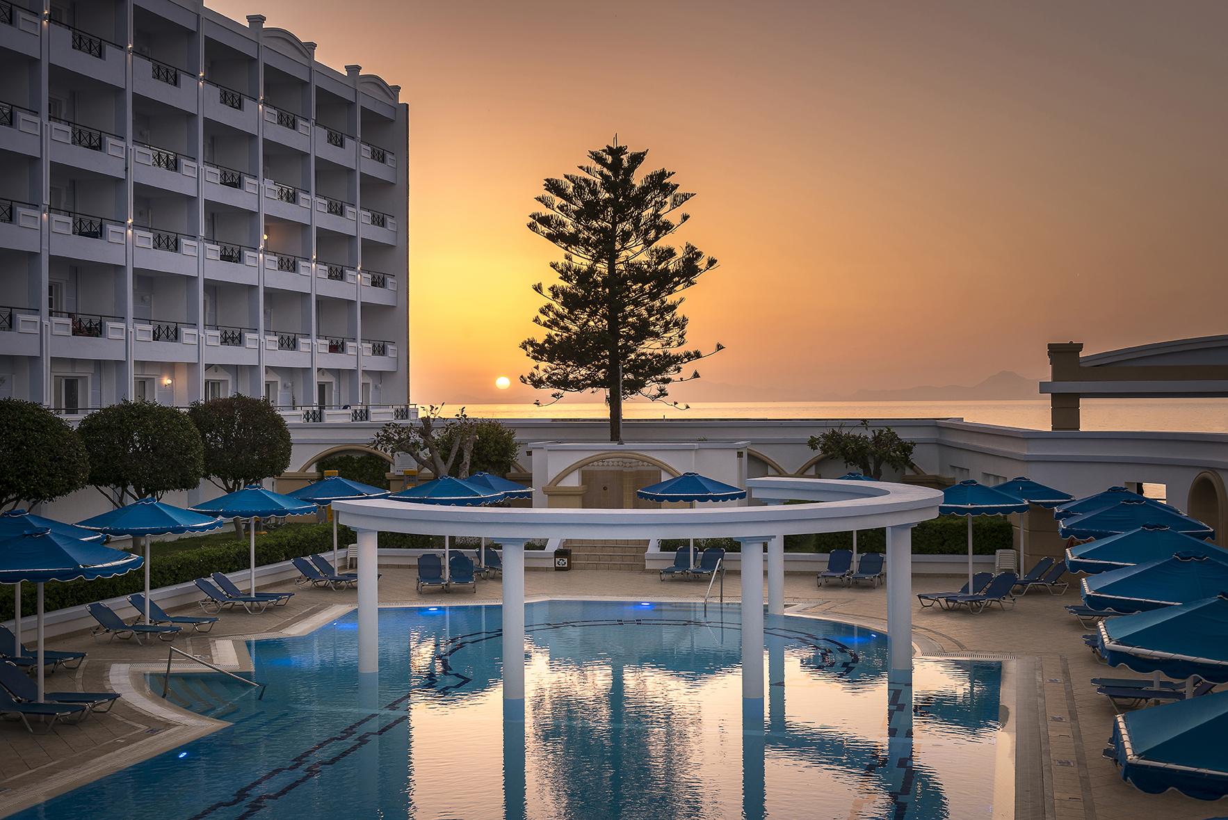 Mitsis Grand Hotel Rhodes City Exterior photo Sunset at the pool