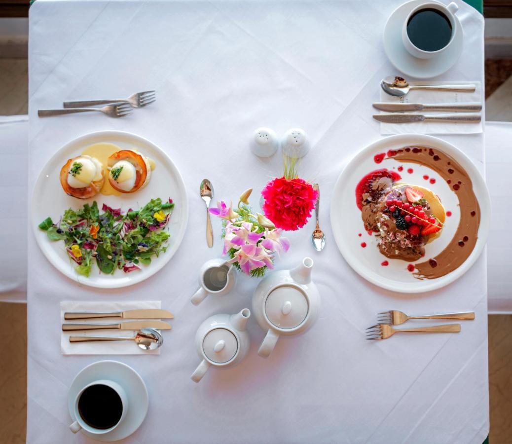 Mitsis Grand Hotel Rhodes City Exterior photo A table set for afternoon tea