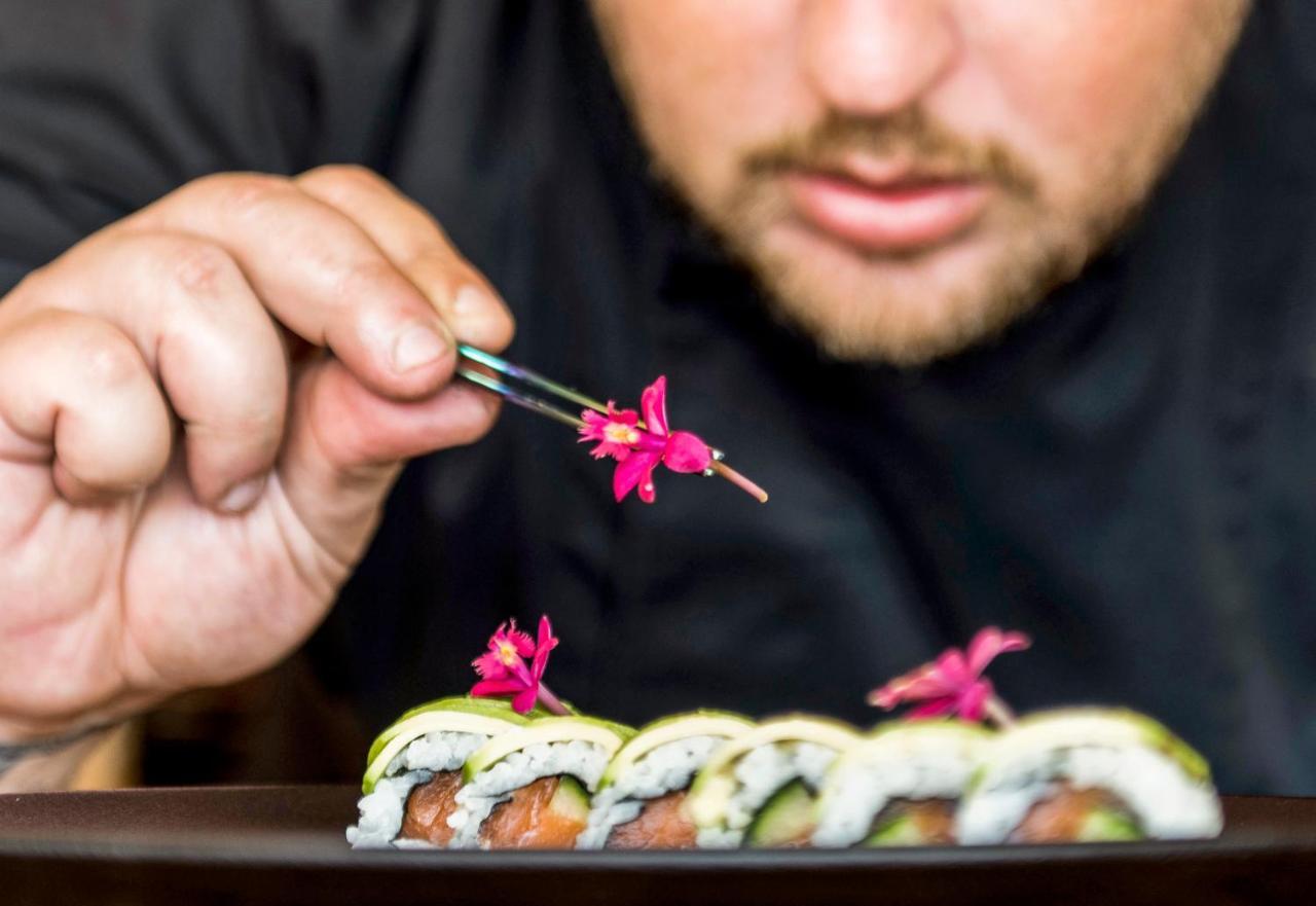 Mitsis Grand Hotel Rhodes City Exterior photo A sushi chef finishing a sushi roll